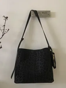 Retro black leopard print tote bag in matte suede finish with a matching mini coin purse