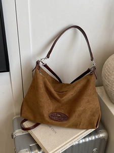 Brown large capacity suede tote bag with leather straps and slouchy casual structure