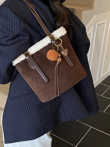 Brown faux suede tote bag with white faux fur trim and heart charms for winter fashion