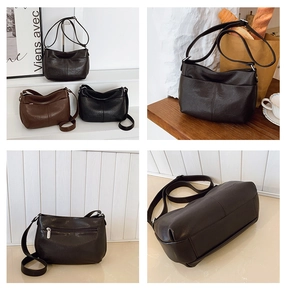 Détail du sac hobo vintage montrant la poche avant, le zip arrière et le fond large