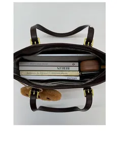 Top view of spacious brown tote bag with striped lining and large internal capacity