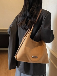 Minimalist camel suede hobo shoulder bag with leather straps for daily commute