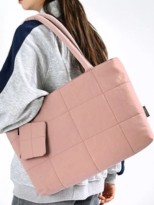 Pink quilted nylon tote bag with small matching pouch for travel and leisure