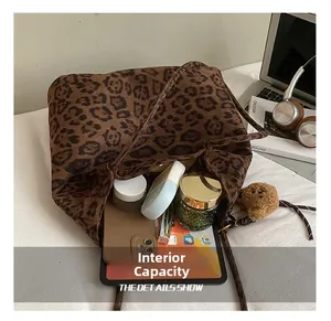 Interior detail of large leopard print tote bag showing spacious storage for daily essentials