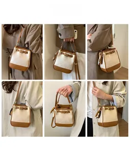 Detail shots of stitching on the color-block bucket bag with wood bead charm