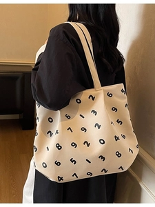 Minimalist off-white canvas tote bag with black numeric print for casual daily use