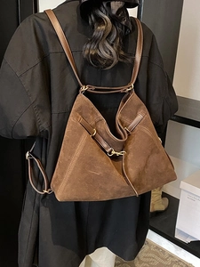 Brown large capacity suede backpack featuring unique pleated design and golden hardware