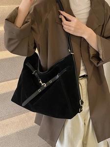 Large black suede tote bag with crossbody strap and gold ring buckle for women