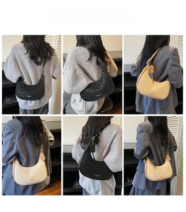 Adjustable shoulder straps and leopard print pattern on these crescent crossbody bags