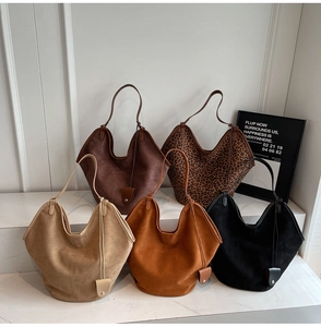 Collection of autumn suede tote bags in various colors including leopard print and neutrals