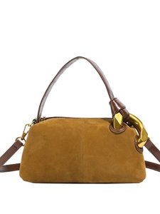 Brown suede pillow bag with luxury gold metal ring detail and adjustable strap