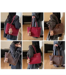 Detail of plaid tote bag with plush bear charm showing on-model shoulder and handbag styles