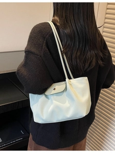 Elegant light mint green leather tote bag for women with minimalist flap and metal buckle