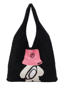 Black fuzzy tote bag with cartoon character patch embroidery and pink bucket hat detail
