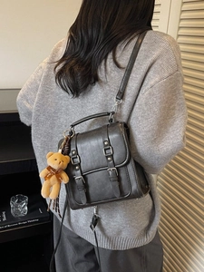 Vintage dark gray PU leather crossbody bag with silver buckles and a cute plush bear charm