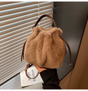 Detailed view of plush brown bucket bag with soft faux fur texture and leather drawstring