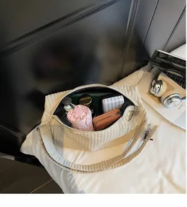 Top view of spacious interior of beige quilted tote bag showing large capacity storage