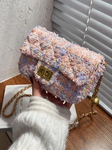 Pink tweed mini crossbody bag with gold chain strap and adjustable metal ball buckle
