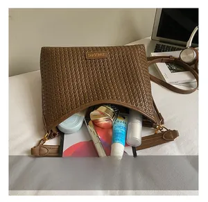 Top view of brown woven tote bag showing spacious interior with daily essentials