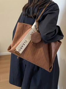 Brown matte leather tote bag with diamond lattice pattern and wide logo shoulder strap