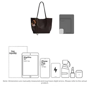 Detailed view of large capacity brown tote bag fits 11 inch iPad and smartphone