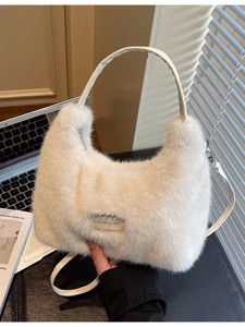 White faux fur crescent handbag with leather handle and love every day tag