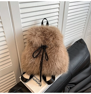 Detail shot of brown faux fur backpack showing soft texture and drawstring closure