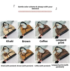 Detail view of suede bucket bags in khaki, brown, and leopard print options
