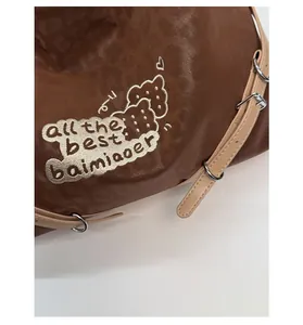 Macro detail of leopard pattern texture with premium embroidery on brown shoulder bag