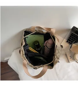 Spacious khaki tote interior showing tablet, umbrella and makeup organized in compartments