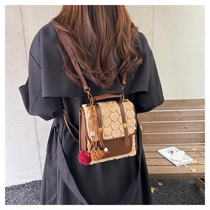 Brown PU leather backpack with heart pattern plush flap and hanging pompom charms