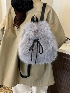Gray faux fur backpack for women featuring soft plush texture and black nylon straps