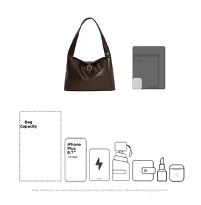 Spacious crescent shoulder bag showing interior capacity for tablet, umbrella and phone