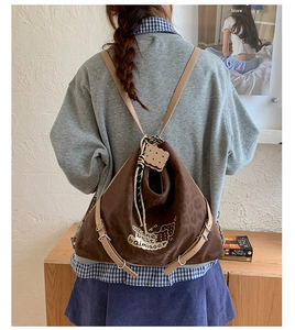 Brown leopard print backpack featuring embroidery and adjustable leather straps