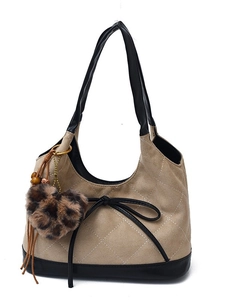 Beige quilted velvet underarm bag with black leather trim and leopard heart charm