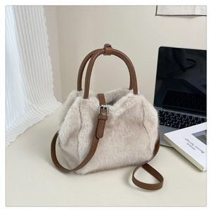 Close-up of beige faux fur crossbody bag with dark brown leather handles and strap