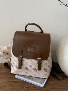 Sac à dos beige à carreaux avec motifs de chat et accents en cuir marron foncé élégant