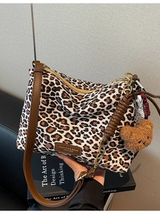 Leopard print canvas tote bag with brown leather straps and cute plush bear charm