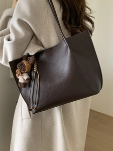 British style large brown leather tote bag with teddy bear pendant and tassel detail