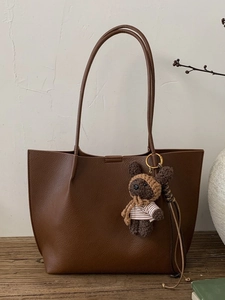 Brown plaid-style tote bag in pebbled leather with cute bear charm and long straps