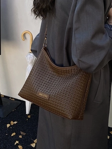 Dark brown woven leather underarm bag for women with minimalist shoulder strap style