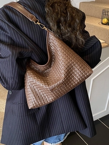 Dark brown woven leather hobo shoulder bag with gold hardware and stylish commuting design