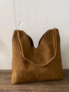 Vintage brown suede tote bag with V-shaped opening and long shoulder straps