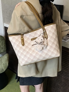 Classic cream checkered tote bag with brown leather straps and cute rabbit pendant