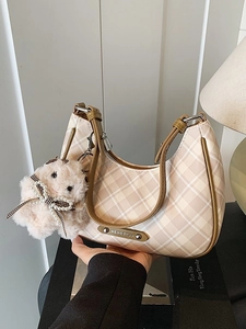 Chic beige and brown plaid crescent hobo bag with plush charm and metal logo detail