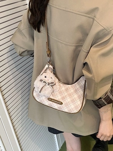 Classic checkered half-moon shoulder bag with plush bunny charm and adjustable strap