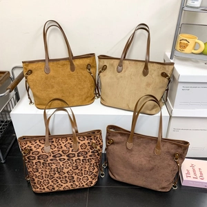 Multiple large tote bags in leopard print and suede finishes for autumn winter styling