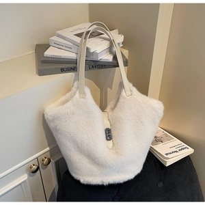 Detailed close-up of white plush tote bag featuring faux fur and silver twist lock