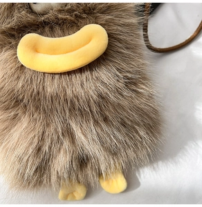 Detailed macro view of the fluffy brown faux fur texture and quirky yellow lip design