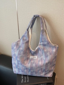 Starry gradient canvas tote bag with artistic pattern for commuting and daily wear